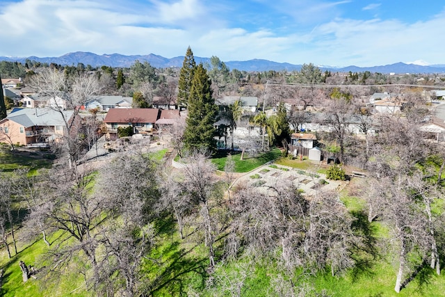 drone / aerial view featuring a residential view and a mountain view