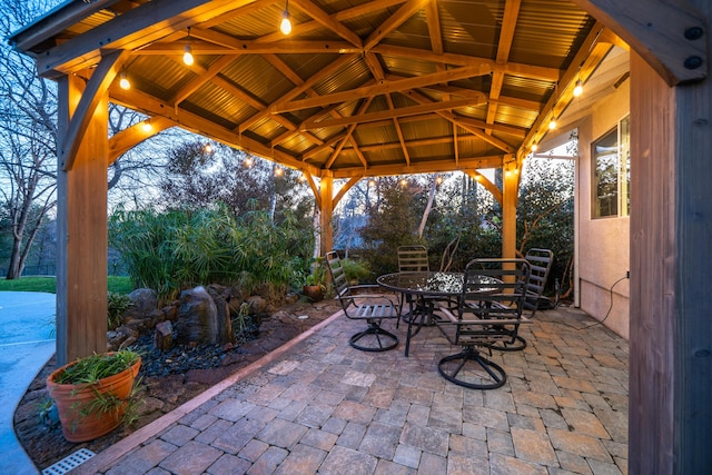 view of patio / terrace with outdoor dining space and a gazebo