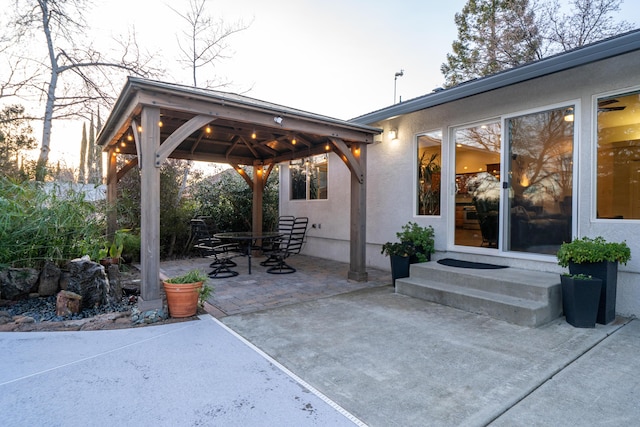 view of patio featuring entry steps and a gazebo