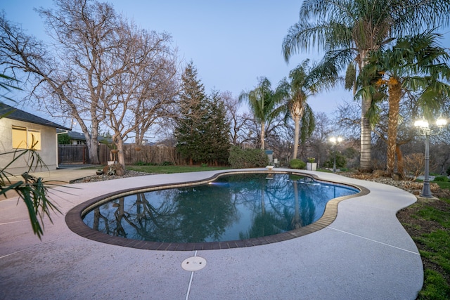 view of pool featuring a patio area, fence, and a fenced in pool