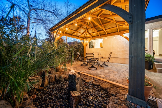 view of patio / terrace with a gazebo and outdoor dining space