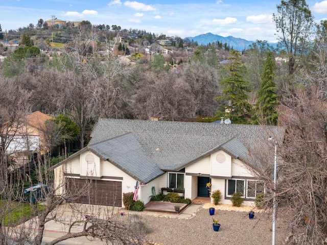 ranch-style house featuring a mountain view and a garage