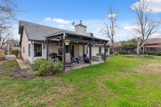 back of property featuring a patio and a lawn