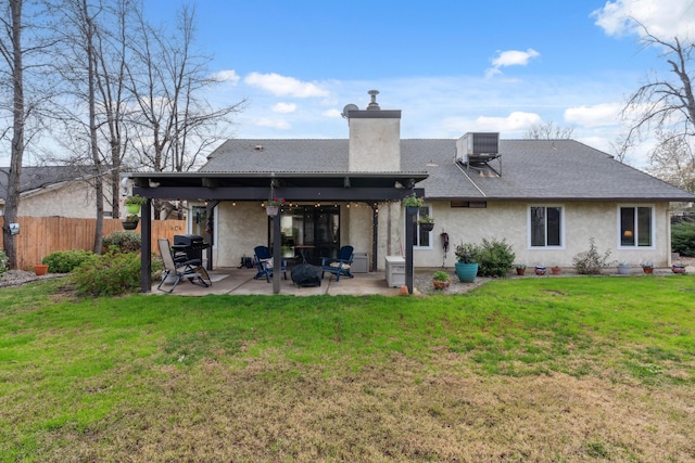 back of house with a yard, central AC, and a patio area