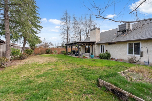 view of yard featuring central AC and a patio