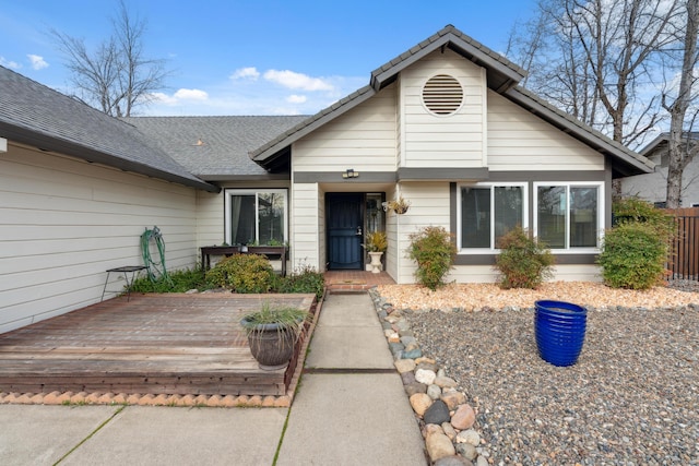 single story home with a wooden deck