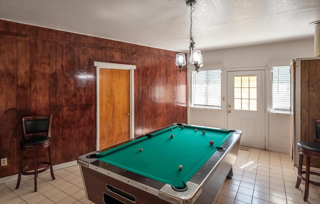 rec room with plenty of natural light, billiards, and wooden walls