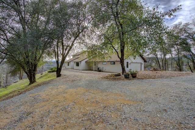 exterior space with driveway and a garage