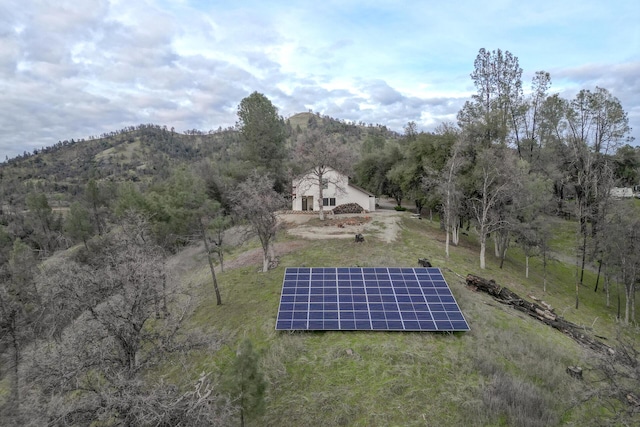 birds eye view of property with a mountain view