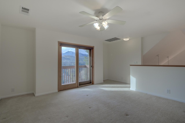 unfurnished room featuring visible vents, ceiling fan, light carpet, and baseboards