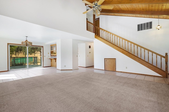 unfurnished living room featuring ceiling fan, high vaulted ceiling, wooden ceiling, light colored carpet, and beamed ceiling