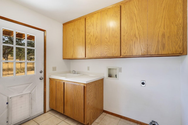 clothes washing area with sink, light tile patterned floors, hookup for a washing machine, cabinets, and hookup for an electric dryer