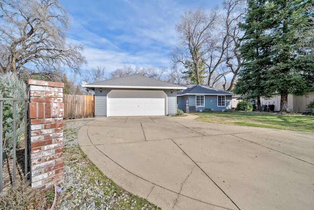 single story home with a garage and a front lawn