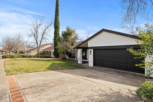 view of property exterior featuring a garage and a yard