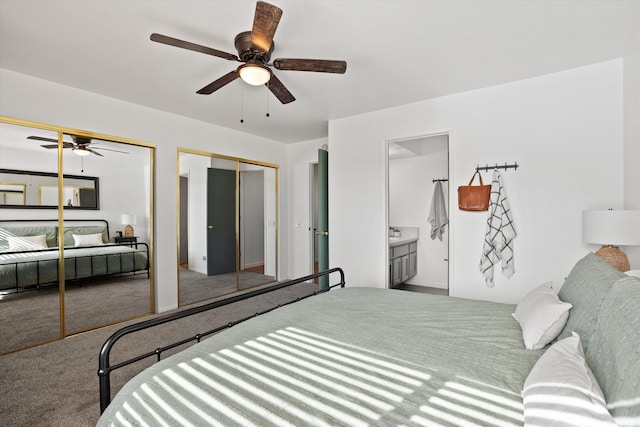 carpeted bedroom with ceiling fan, ensuite bath, and multiple closets