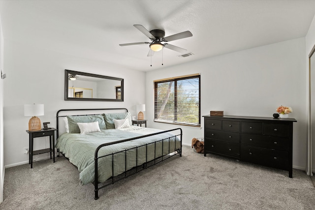 bedroom featuring light colored carpet and ceiling fan