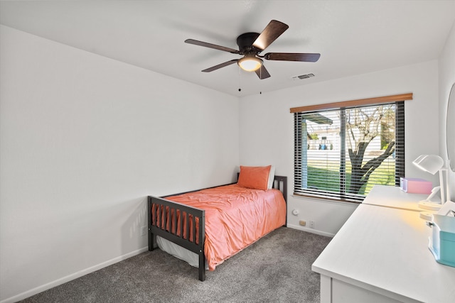 bedroom featuring ceiling fan and dark carpet