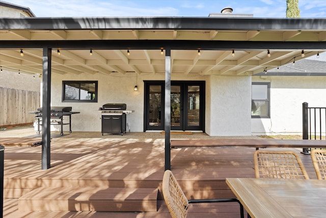 wooden terrace with a grill