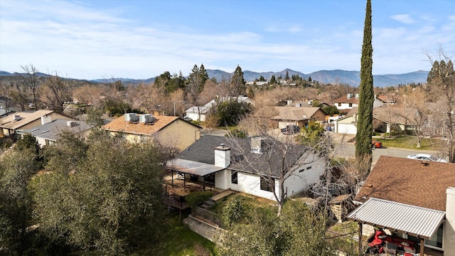 birds eye view of property with a mountain view