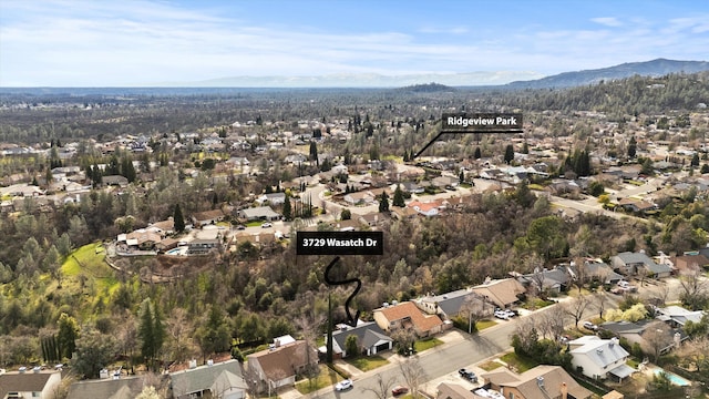 drone / aerial view featuring a mountain view