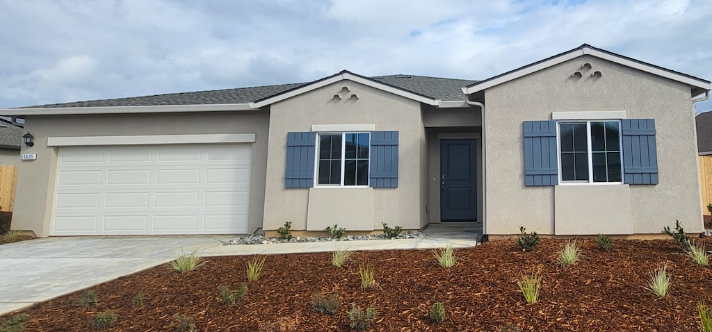 ranch-style house featuring a garage