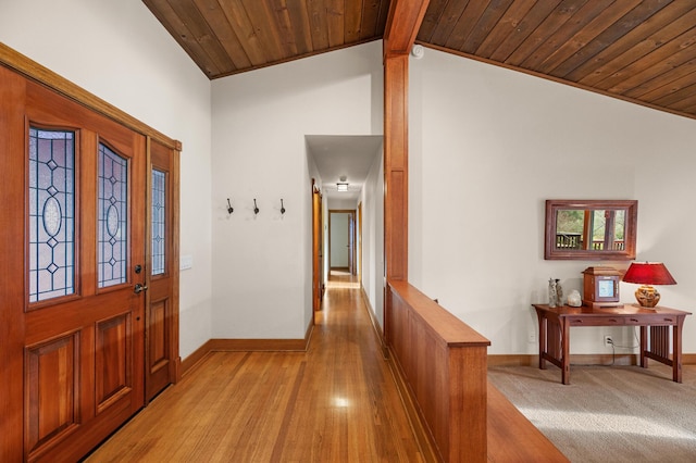 entrance foyer with wooden ceiling, baseboards, light wood finished floors, and high vaulted ceiling