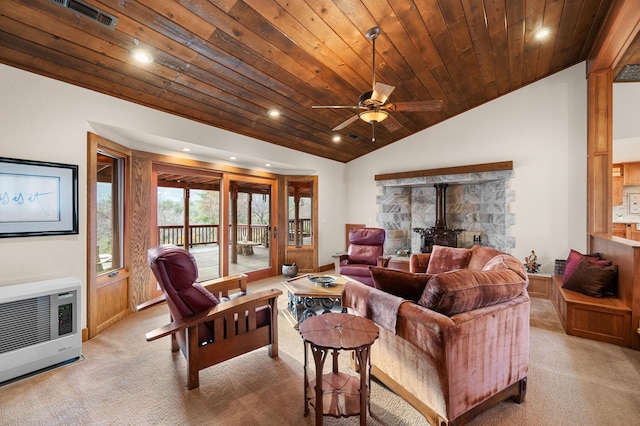 living room featuring light carpet, wood ceiling, vaulted ceiling, heating unit, and a wood stove