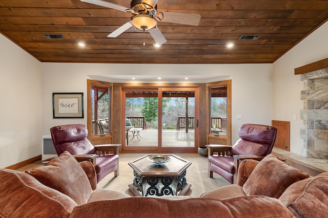 living area with light carpet, wood ceiling, visible vents, and vaulted ceiling