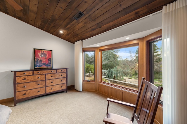 sitting room featuring lofted ceiling, a healthy amount of sunlight, wood ceiling, and light carpet