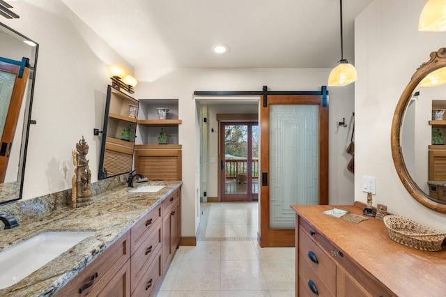 bathroom featuring double vanity, tile patterned flooring, a sink, and recessed lighting