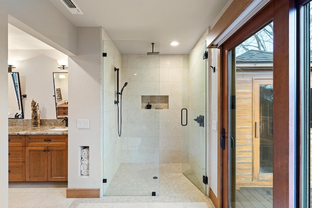 bathroom featuring tile patterned flooring, vanity, visible vents, a sauna, and a shower stall