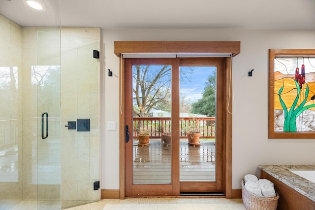 doorway to outside featuring baseboards