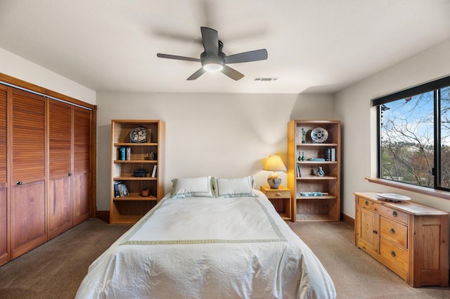 bedroom with a ceiling fan, carpet, a closet, and visible vents