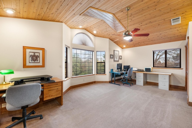 office area with high vaulted ceiling, wooden ceiling, light carpet, a skylight, and visible vents