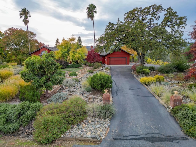 view of front of home with driveway and an attached garage