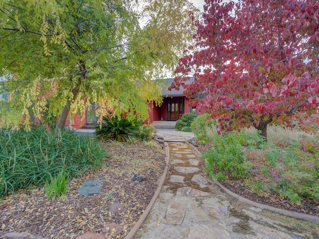 view of property hidden behind natural elements