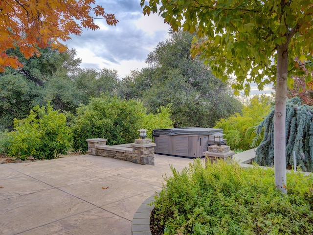 view of patio / terrace featuring a hot tub