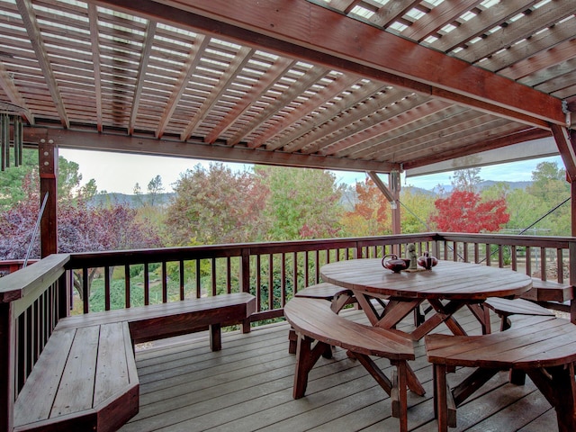 wooden deck featuring outdoor dining space