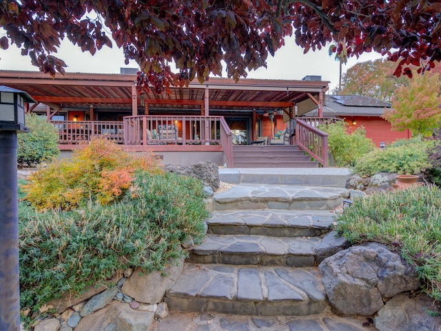 entrance to property with a wooden deck