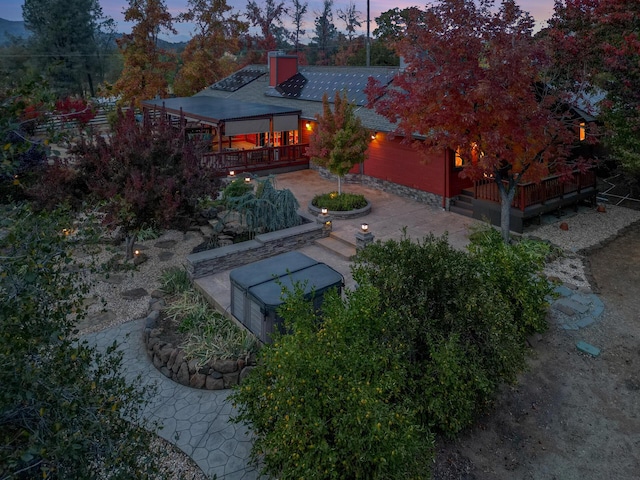 yard at dusk with a patio