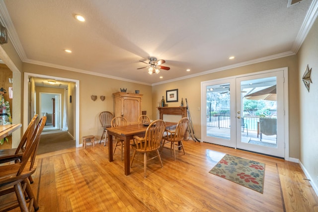 dining room with light wood-style flooring, recessed lighting, baseboards, french doors, and crown molding