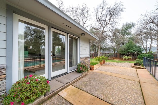 view of patio / terrace with a fenced in pool and a fenced backyard