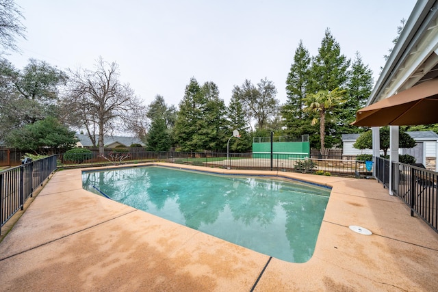 view of swimming pool with a patio area, a fenced backyard, and a fenced in pool