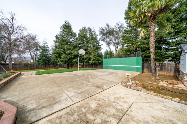 view of sport court with a fenced backyard