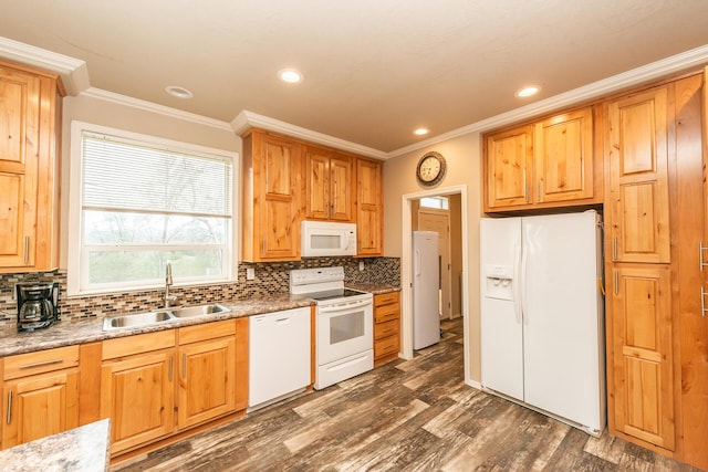 kitchen featuring sink, white appliances, crown molding, and dark hardwood / wood-style floors