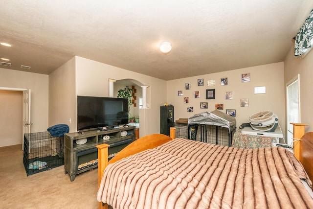 bedroom with light carpet