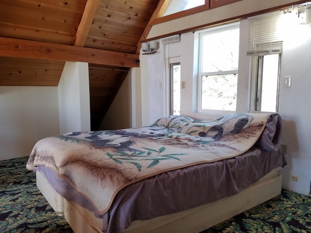 carpeted bedroom featuring vaulted ceiling with beams and wood ceiling