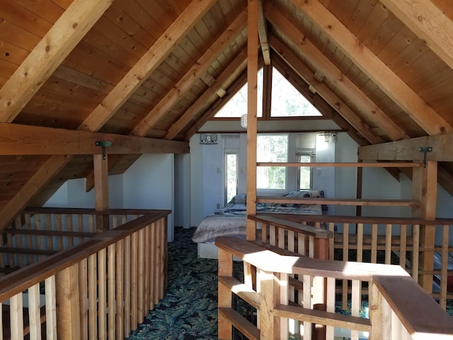 interior space with wooden ceiling and lofted ceiling with beams