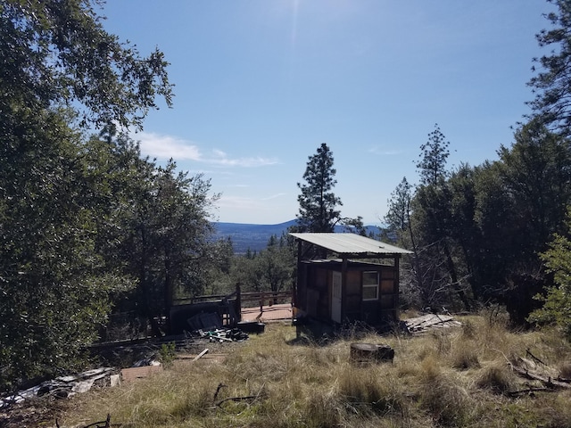 exterior space with an outbuilding and a storage shed