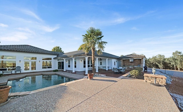 back of house with a patio